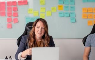 Business leader sat behind desk.